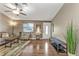 Inviting living room with hardwood floors, neutral tones, and ample natural light, creating a warm and welcoming atmosphere at 5211 Prime Ter, North Port, FL 34286