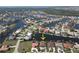 Aerial view of a waterfront home with boat dock, located in an extensive canal community at 556 Monaco Dr, Punta Gorda, FL 33950