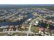 Aerial view of a waterfront home with boat dock, located in an extensive canal community at 556 Monaco Dr, Punta Gorda, FL 33950