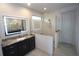Bathroom featuring a double vanity and walk-in shower at 556 Monaco Dr, Punta Gorda, FL 33950