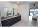 Bathroom with double sink vanity, lighted mirror and access to the bedroom at 556 Monaco Dr, Punta Gorda, FL 33950