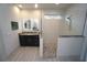 Bathroom showcasing a walk-in shower and vanity with granite counters at 556 Monaco Dr, Punta Gorda, FL 33950