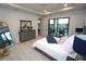 Bedroom overlooking patio with a king bed and a stylish ensuite bathroom at 556 Monaco Dr, Punta Gorda, FL 33950