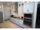 The kitchen features custom cabinets, stainless steel appliances, and a modern gas cooktop at 556 Monaco Dr, Punta Gorda, FL 33950
