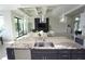 The kitchen features a large center island with stainless steel sink, modern lighting and plenty of counter space at 556 Monaco Dr, Punta Gorda, FL 33950