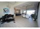 Open concept living area showcases seamless flow with a piano and view of the bright and modern kitchen at 556 Monaco Dr, Punta Gorda, FL 33950