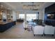 Bright and airy living room features a modern ceiling fan, opening to a beautiful outdoor space at 556 Monaco Dr, Punta Gorda, FL 33950