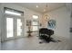 Bright, airy living room with tile floors, high ceilings, modern light fixtures, and a grand piano at 556 Monaco Dr, Punta Gorda, FL 33950