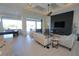 Contemporary living room featuring a sleek fireplace, modern furnishings, and expansive views of the outdoors at 556 Monaco Dr, Punta Gorda, FL 33950