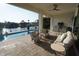 Covered outdoor patio with a kitchen overlooking the pool and canal at 556 Monaco Dr, Punta Gorda, FL 33950