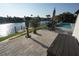 Waterfront patio with lounge chairs and dining table with views of the canal at 556 Monaco Dr, Punta Gorda, FL 33950