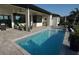 Inviting outdoor pool and patio area, perfect for relaxing and entertaining with outdoor seating at 556 Monaco Dr, Punta Gorda, FL 33950