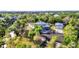 Aerial view of a beautiful home surrounded by lush landscaping and greenery at 5601 Taylor Rd, Punta Gorda, FL 33950