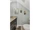 Powder room with granite vanity, modern faucet, and decorative wall accents at 5601 Taylor Rd, Punta Gorda, FL 33950