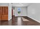 Clean bedroom with hardwood floors, ceiling fan, large window, and natural lighting at 5601 Taylor Rd, Punta Gorda, FL 33950