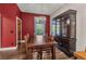 Dining area with wood table and chairs with a window for plenty of light at 5601 Taylor Rd, Punta Gorda, FL 33950