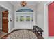 Lovely entryway featuring hardwood floors, double doors, a chandelier and elegant decor at 5601 Taylor Rd, Punta Gorda, FL 33950