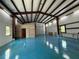 Interior view of separate oversized garage with roll-up door and ample storage and work space at 5601 Taylor Rd, Punta Gorda, FL 33950