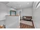 Cozy hallway with a futon, bookshelf, and modern decor at 5601 Taylor Rd, Punta Gorda, FL 33950