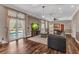 Spacious living room with a fireplace, wood floors, and pool views at 5601 Taylor Rd, Punta Gorda, FL 33950