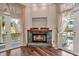 Bright living room with a marble fireplace and views of the outdoors at 5601 Taylor Rd, Punta Gorda, FL 33950