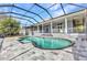 Large screened-in pool, patio, and partial view of the home's exterior at 5601 Taylor Rd, Punta Gorda, FL 33950
