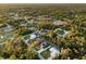 Expansive aerial view highlighting the neighborhood's lush greenery, well-maintained streets, and community layout at 6938 Rabbit Ave, North Port, FL 34291