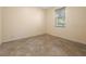 Neutral bedroom with tile flooring and a window with blinds at 6938 Rabbit Ave, North Port, FL 34291