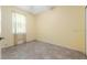 Cozy bedroom with tile flooring and a window with light-filtering curtains at 6938 Rabbit Ave, North Port, FL 34291