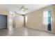 Neutral bedroom with tile flooring, ceiling fan, and lots of natural light at 6938 Rabbit Ave, North Port, FL 34291