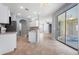 Bright kitchen with tile flooring, island counter, and modern appliances, perfect for cooking and entertaining at 6938 Rabbit Ave, North Port, FL 34291