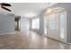 Spacious living room featuring neutral walls, large windows, and tile floors throughout at 6938 Rabbit Ave, North Port, FL 34291