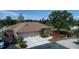 Exterior shot of a charming home featuring a spacious two-car garage and cozy deck area for outdoor relaxation at 825 Robinhood Dr, Punta Gorda, FL 33982