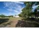 Expansive backyard with mature trees and lush greenery at 825 Robinhood Dr, Punta Gorda, FL 33982
