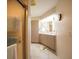 Bright bathroom with a shower, vanity, and tiled flooring at 825 Robinhood Dr, Punta Gorda, FL 33982