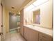 Well-lit bathroom with a glass shower and modern vanity at 825 Robinhood Dr, Punta Gorda, FL 33982