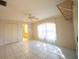 Large bright bedroom with en suite bathroom, and tile floors at 825 Robinhood Dr, Punta Gorda, FL 33982