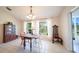 Bright dining room with natural light, large windows, and tile floor at 825 Robinhood Dr, Punta Gorda, FL 33982