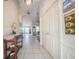Inviting foyer featuring tiled flooring, a decorative console table, and a view into the spacious living area at 825 Robinhood Dr, Punta Gorda, FL 33982