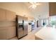 Bright kitchen with stainless steel refrigerator and ample counter space at 825 Robinhood Dr, Punta Gorda, FL 33982