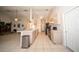 Open kitchen featuring an eat-in bar top and white cabinets at 825 Robinhood Dr, Punta Gorda, FL 33982