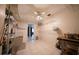 Spacious laundry room featuring tile floors, storage shelves, and modern washer and dryer at 825 Robinhood Dr, Punta Gorda, FL 33982
