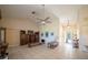 Bright and airy living room showcasing tile flooring, a ceiling fan, and neutral decor at 825 Robinhood Dr, Punta Gorda, FL 33982