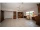 Large living room area featuring tiled floors and a ceiling fan at 825 Robinhood Dr, Punta Gorda, FL 33982
