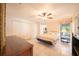 Spacious main bedroom featuring a ceiling fan, tile flooring, and a large closet at 825 Robinhood Dr, Punta Gorda, FL 33982