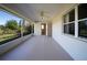 Screened in patio overlooking backyard, providing an outdoor retreat at 825 Robinhood Dr, Punta Gorda, FL 33982