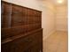 Walk-in closet with shelving beside an antique dresser at 825 Robinhood Dr, Punta Gorda, FL 33982