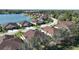 Scenic aerial view of homes in a lakeside community with lush landscaping and well-maintained streets at 8866 Tuscany Isles Dr, Punta Gorda, FL 33950