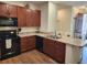 Well-equipped kitchen featuring sleek black appliances and ample counter space at 8866 Tuscany Isles Dr, Punta Gorda, FL 33950