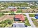 Aerial view of an expansive residential area, lush landscape, and waterfront homes at 10393 Harlingen St, Port Charlotte, FL 33981
